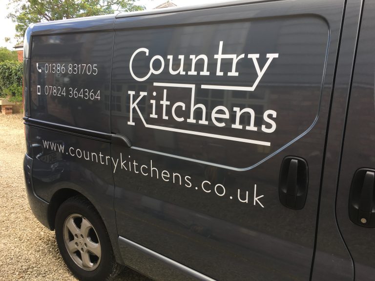 Country Kitchens van - Side view with logo and phone number