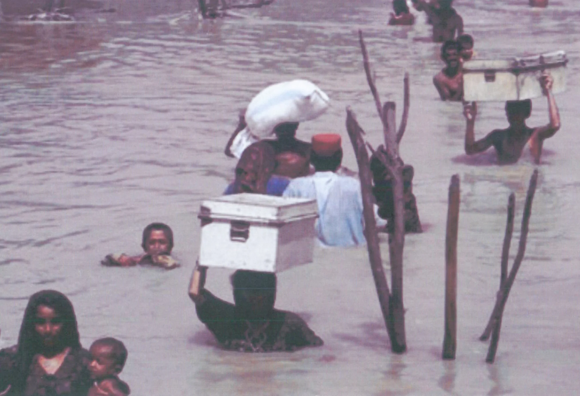 A.C. contributes to climate change. In countries like Bangladesh (shown here) flash floods caused by climate change leave people displaced and without proper resources.