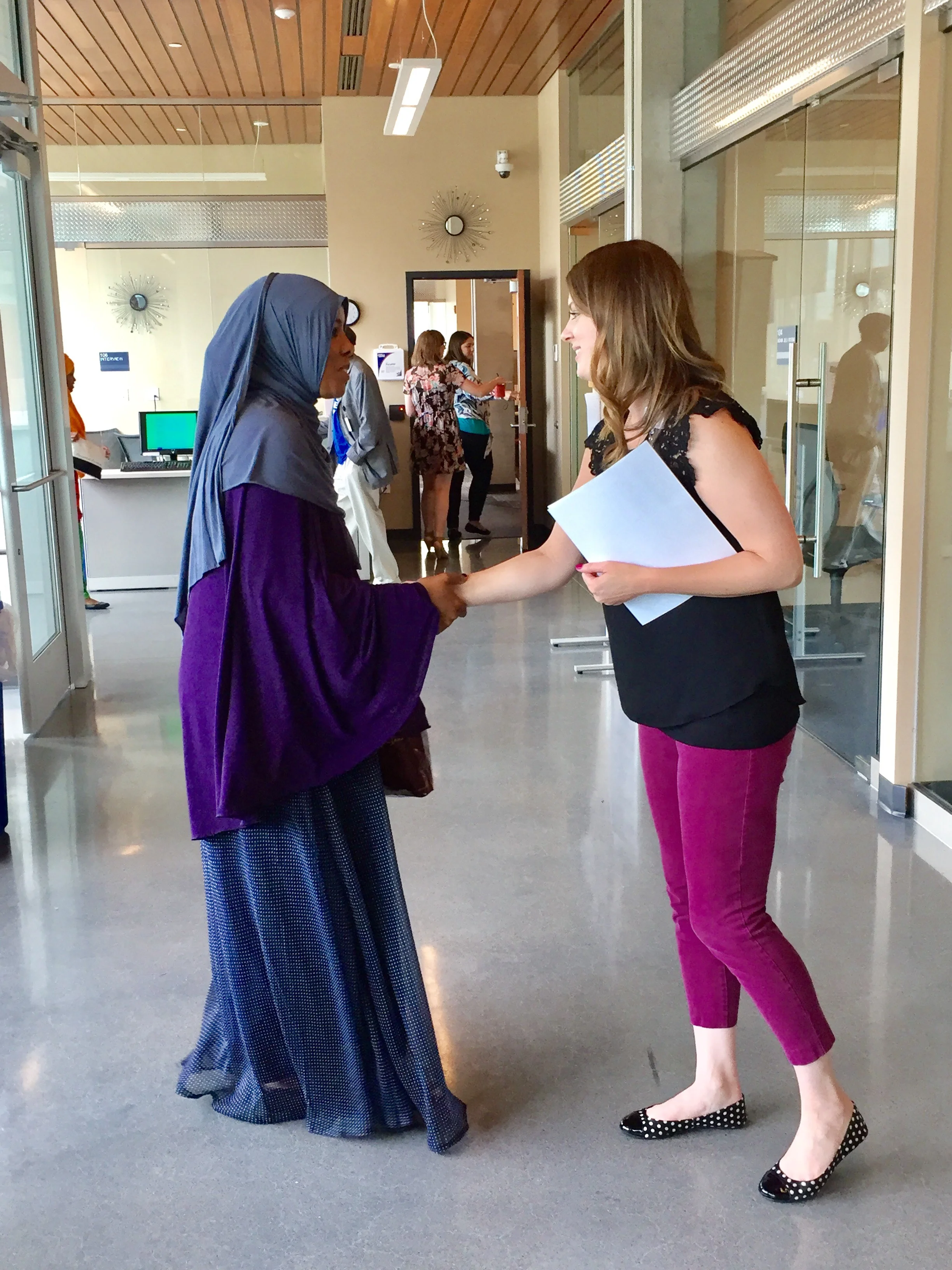 Fairview recruiting specialist Blair Winter welcomes a job seeker at the Cedar Riverside Opportunity Center