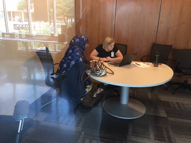 Regina Pekarek, right, meets with Cedar Riverside job seeker Saido Haji Abdulle