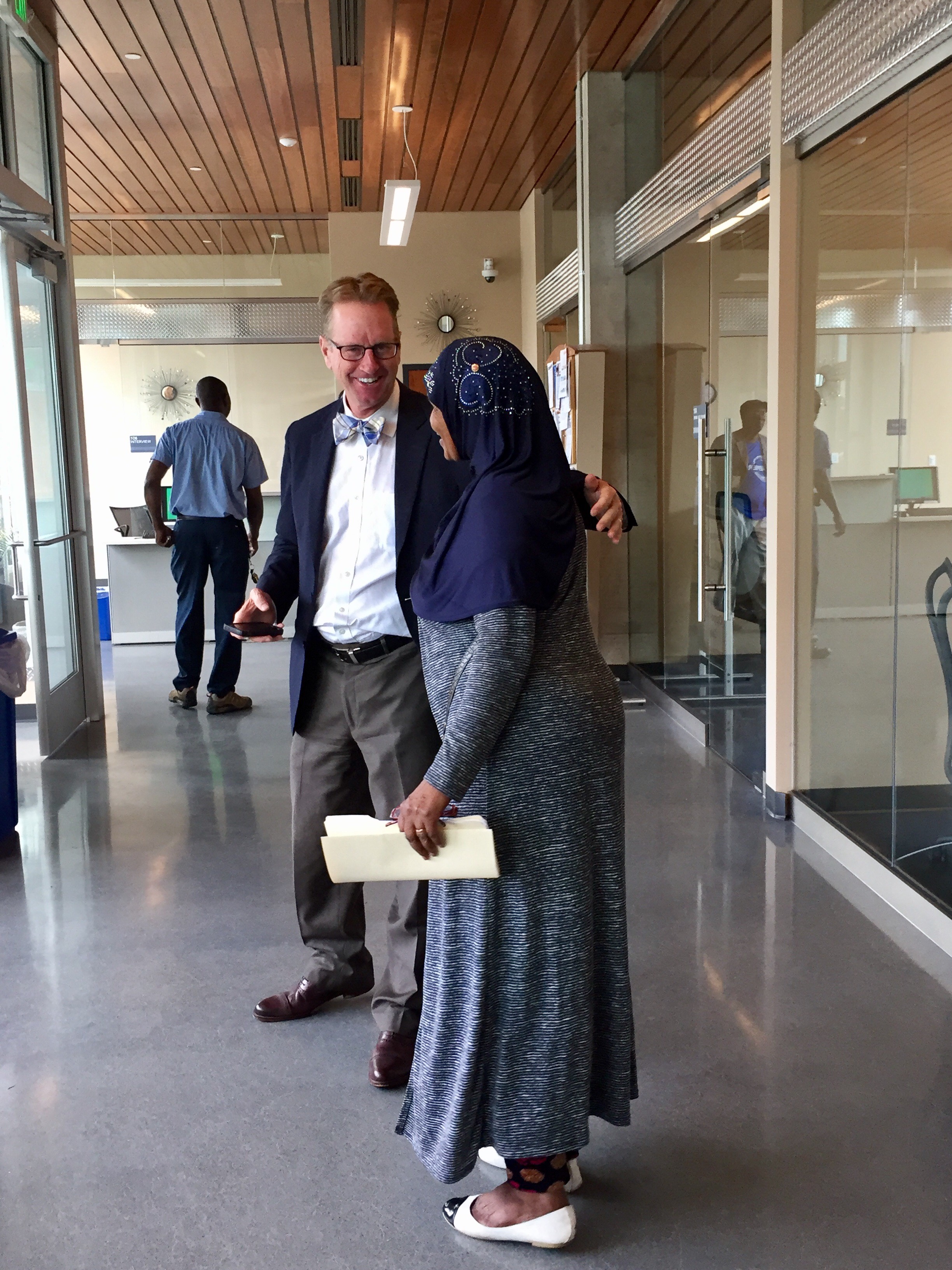 Mike Christenson, Hennepin County Workforce Development Director, and Helima Ainte, Cedar Riverside Opportunity Center team member