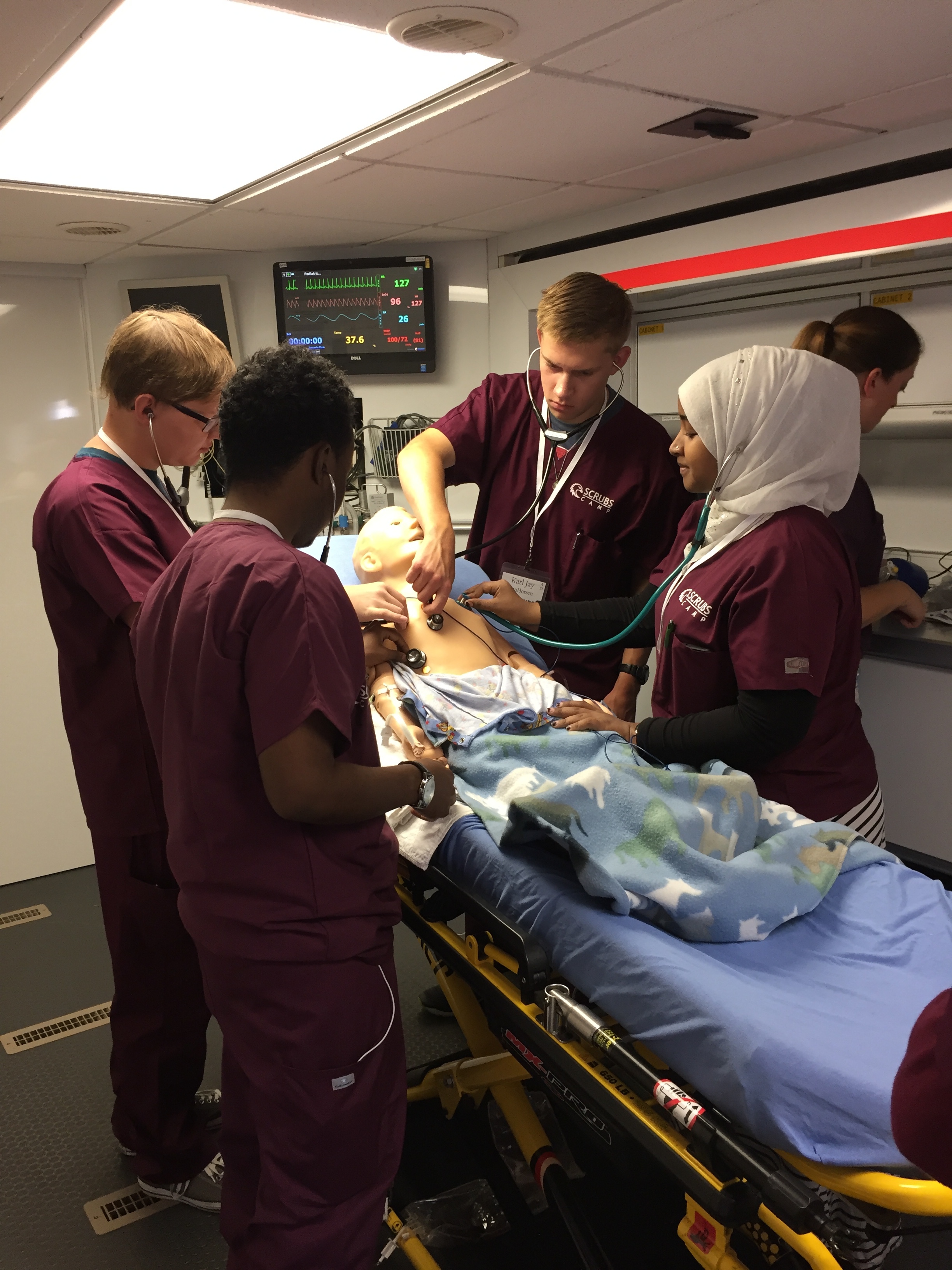   The campers took turns checking for breathing and offering diagnoses. After diagnosing their patient with pneumonia and trouble breathing, the students got to administer a sedative and paralytic, and even inserted a breathing tube.  