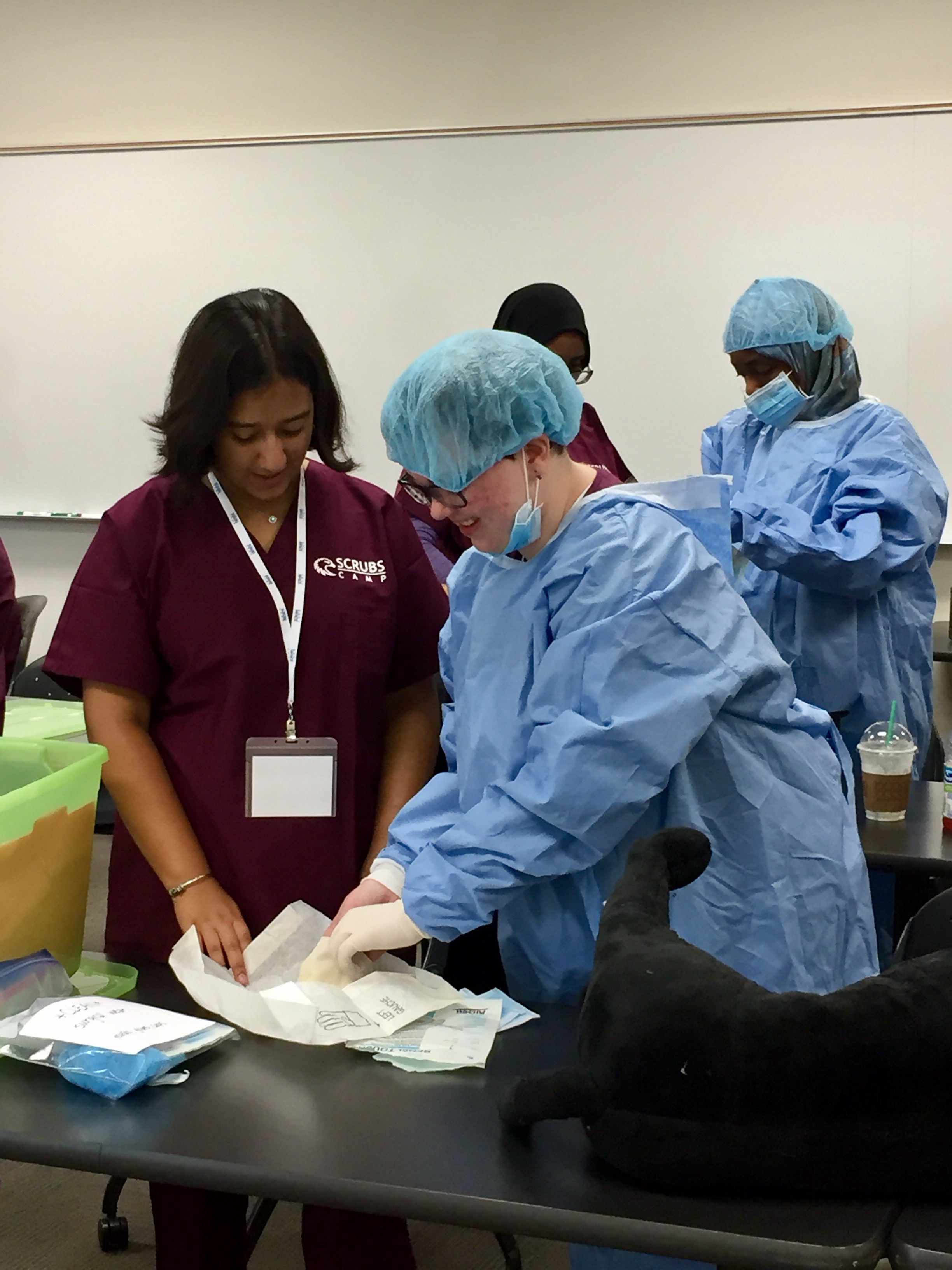   After the overview, it was time to put what they had learned into practice. Plush dogs equipped with mock internal organs served as the “patients.” After assessing their patients, the students determined the animals needed surgical care. They had t