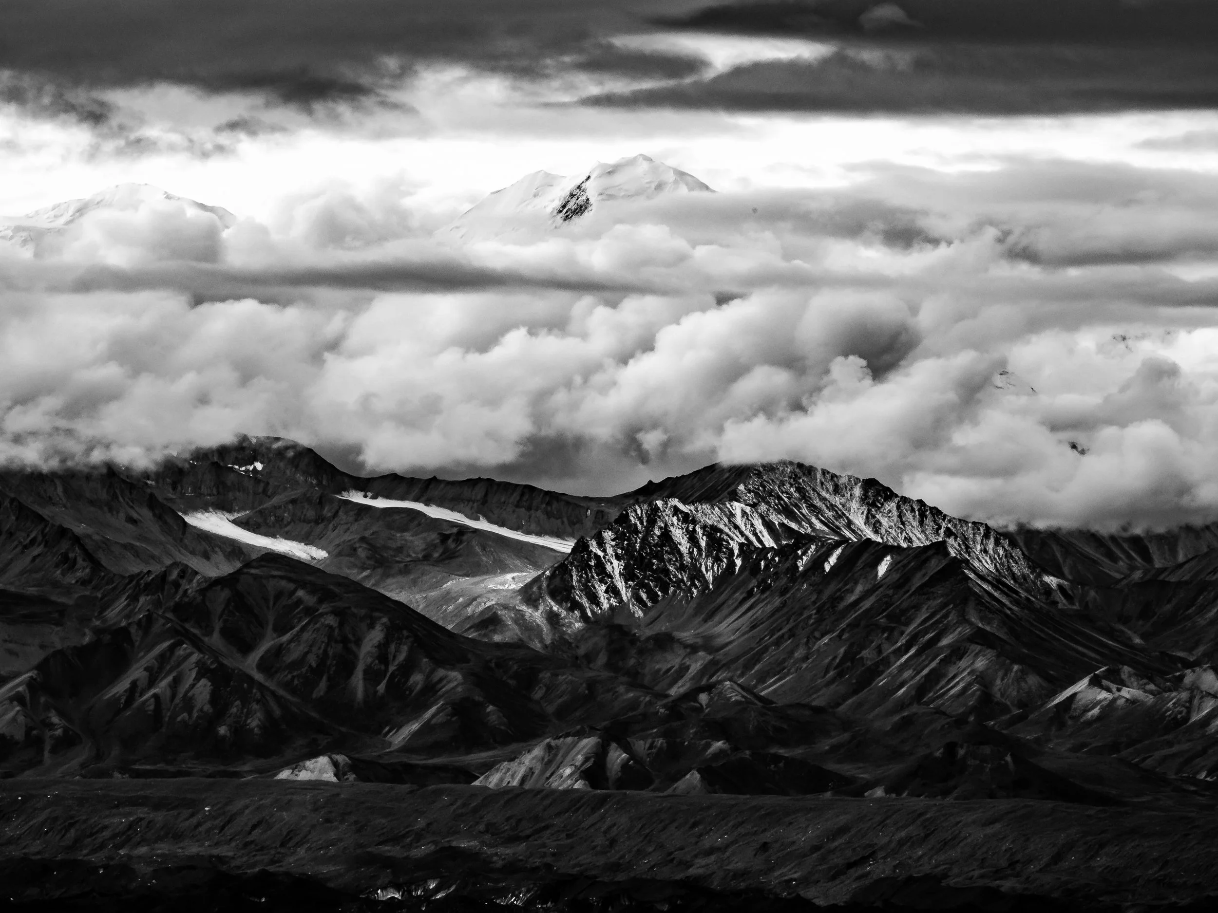 Denali's summit peeking above the clouds.