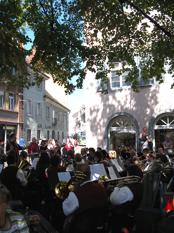 A band plays in a small square in Freiburg.