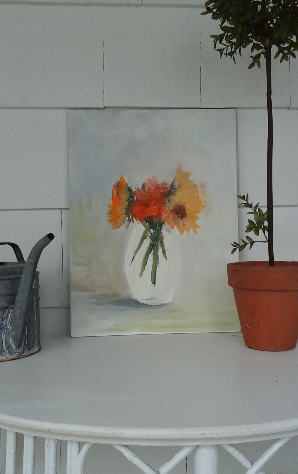 A sunflower painting I started a while back...still needs work on the vase and background but I'm liking the looseness and spontaneity of the flowers...