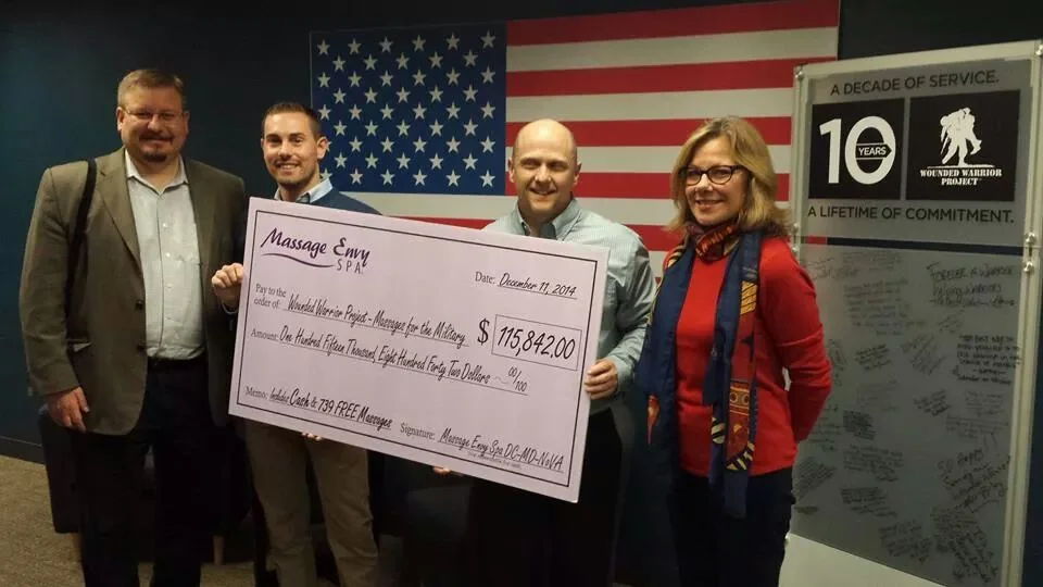 While with LevLane: Presenting check to Wounded Warriors in Washington, DC on behalf of Massage Envy Spas' "Massages for Military" event