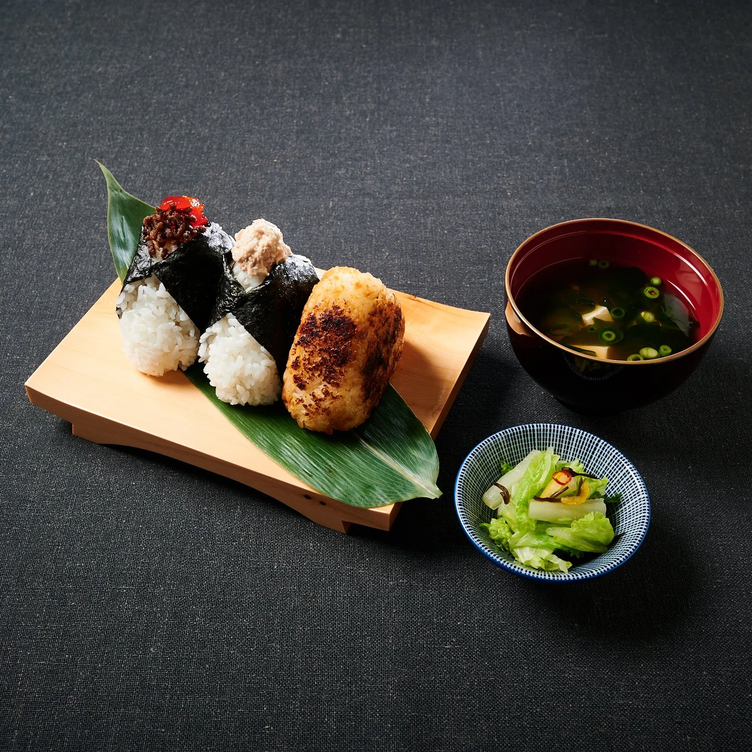 Onigiri box with 3 assorted onigiri, pickles, and miso soup