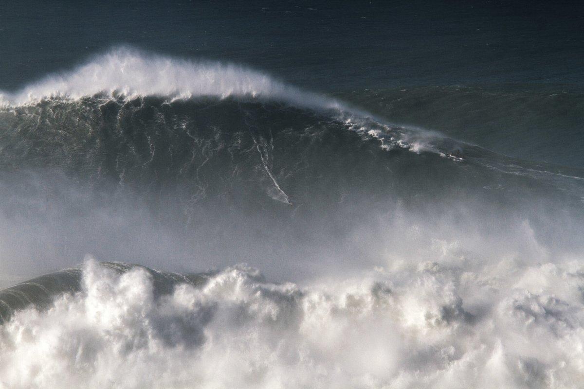 Brazilian surfer Rodrigo Kona rides his record-setting 80-foot monster wave at Nazare, Portugal. Photo taken November 8, 2017. (Photo: Pedro Cruz/AP)