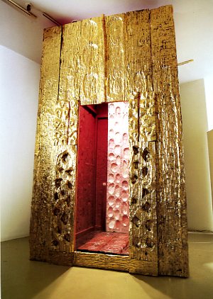 Spirit House of the Mother, 1995, C arved and painted wood with gold leaf and encaustic, 11' X 6' X 7'