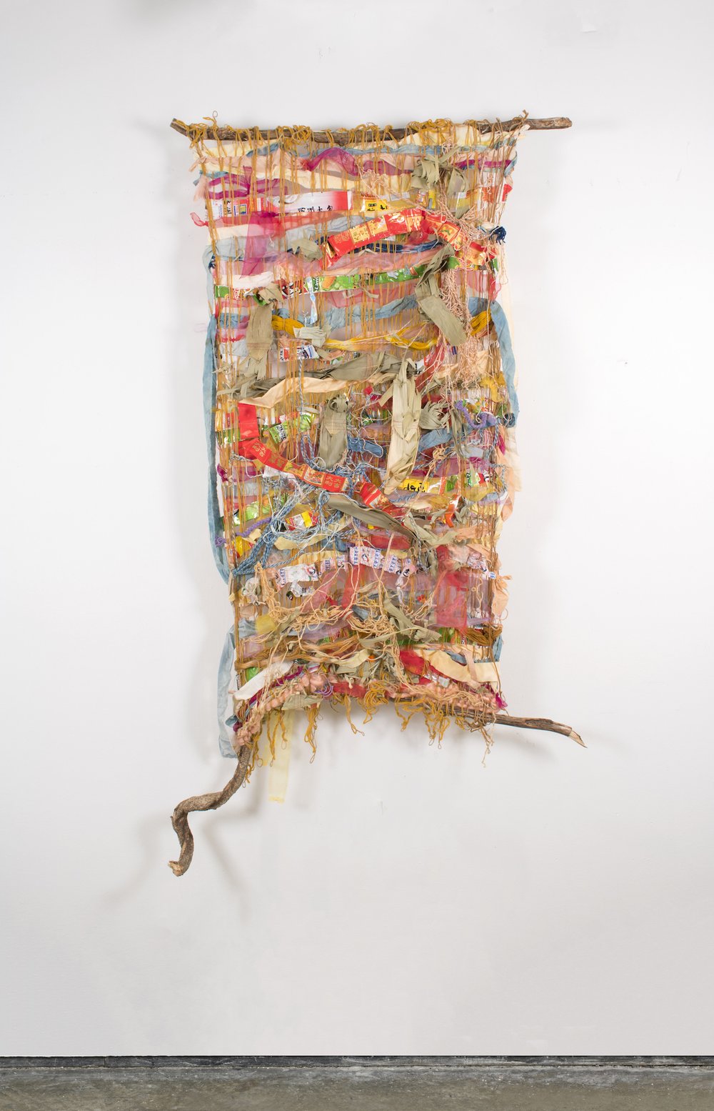  Zoila Andrea Coc-Chang,  cosas de la vida , 2021. Bittersweet branch, naturally dyed cotton, silk organza, wool, indigo, banana leaves, jute, thread, paper, and food wrappers from family, friends and my own consumption; 7 ft. x 3.5 ft. x 6 in. Photo