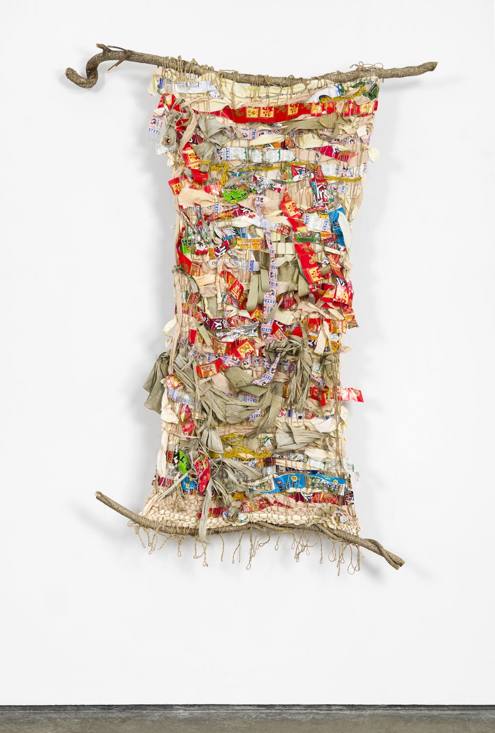  Zoila Andrea Coc-Chang,  tejiendo el universe leng3 , 2021, Bittersweet tree branch, jute, thread, naturally dyed cotton, wool, paper, bamboo leaves, banana leaves and food wrappers from family friends, and my own consumption, 6.5 feet x 4 feet x 6 