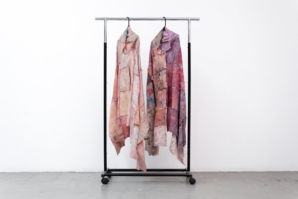  Xinyi Liu,  Hanging Skins , 2022, disposable washcloth, acrylic, hanger, portable wardrobe, sewing thread, 37 2/5 x 58 3/10 x 23 3/5 inches 