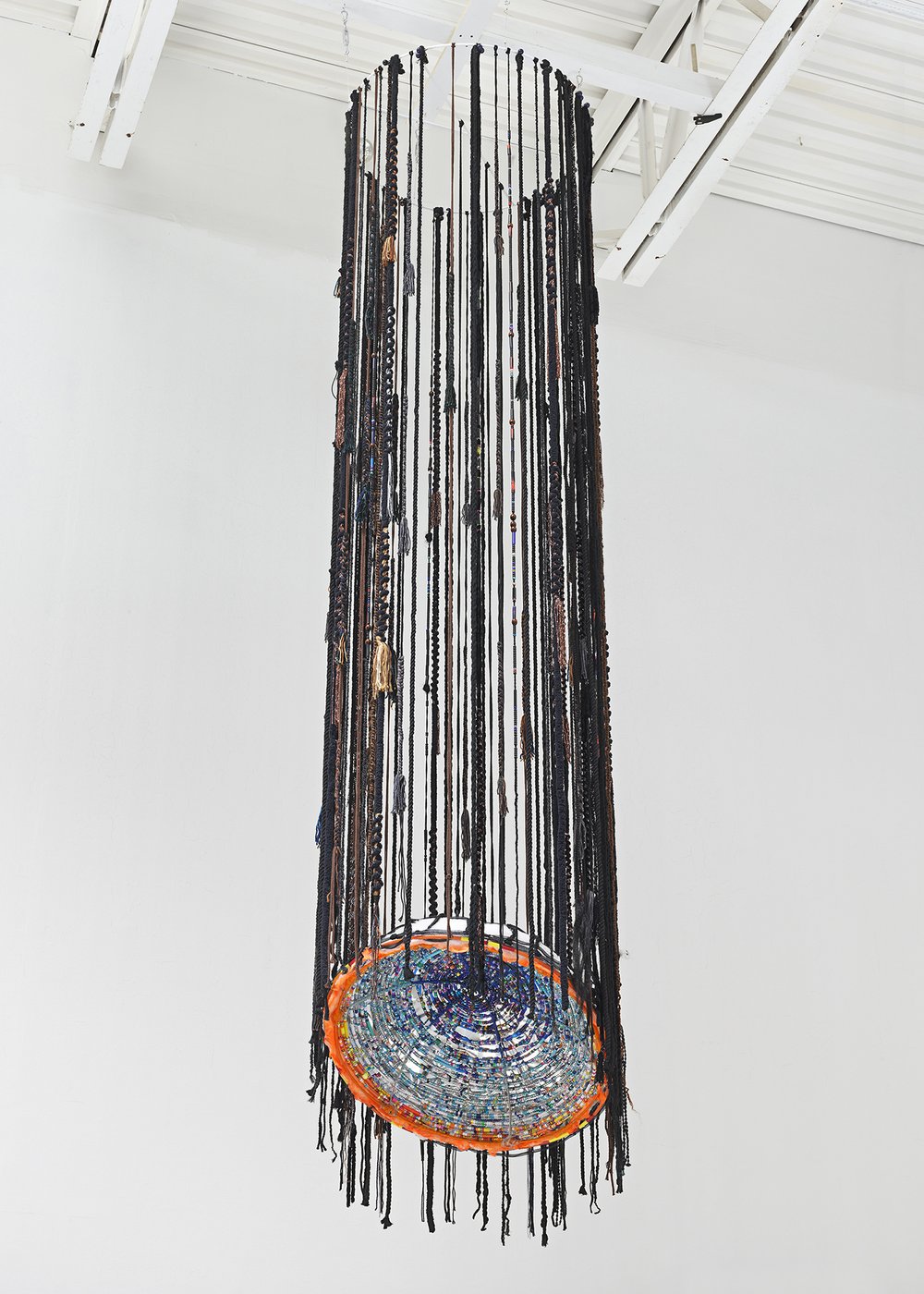 Quinci Baker,  Wish Upon a Dying Star , 2022, Steel, mixed yarn, cotton string, synthetic hair, jump rope beads, pony beads, glass beads, 144 x 32 x 32 inches. 