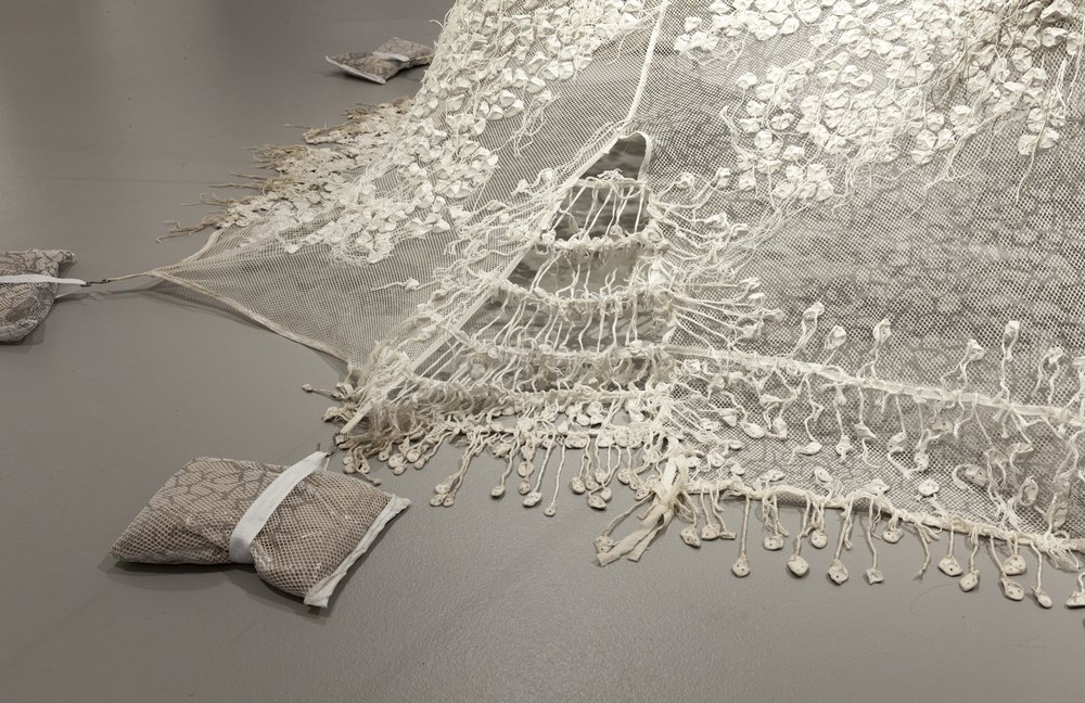  Mimi Biyao Bai,  Conjuring a future full of pasts , 2020–2022, Clay, thread, jute, silk screened netting, canvas, sand, steel, dimensions variable (this installation is 42 x 132 x 108 inches).&nbsp; 
