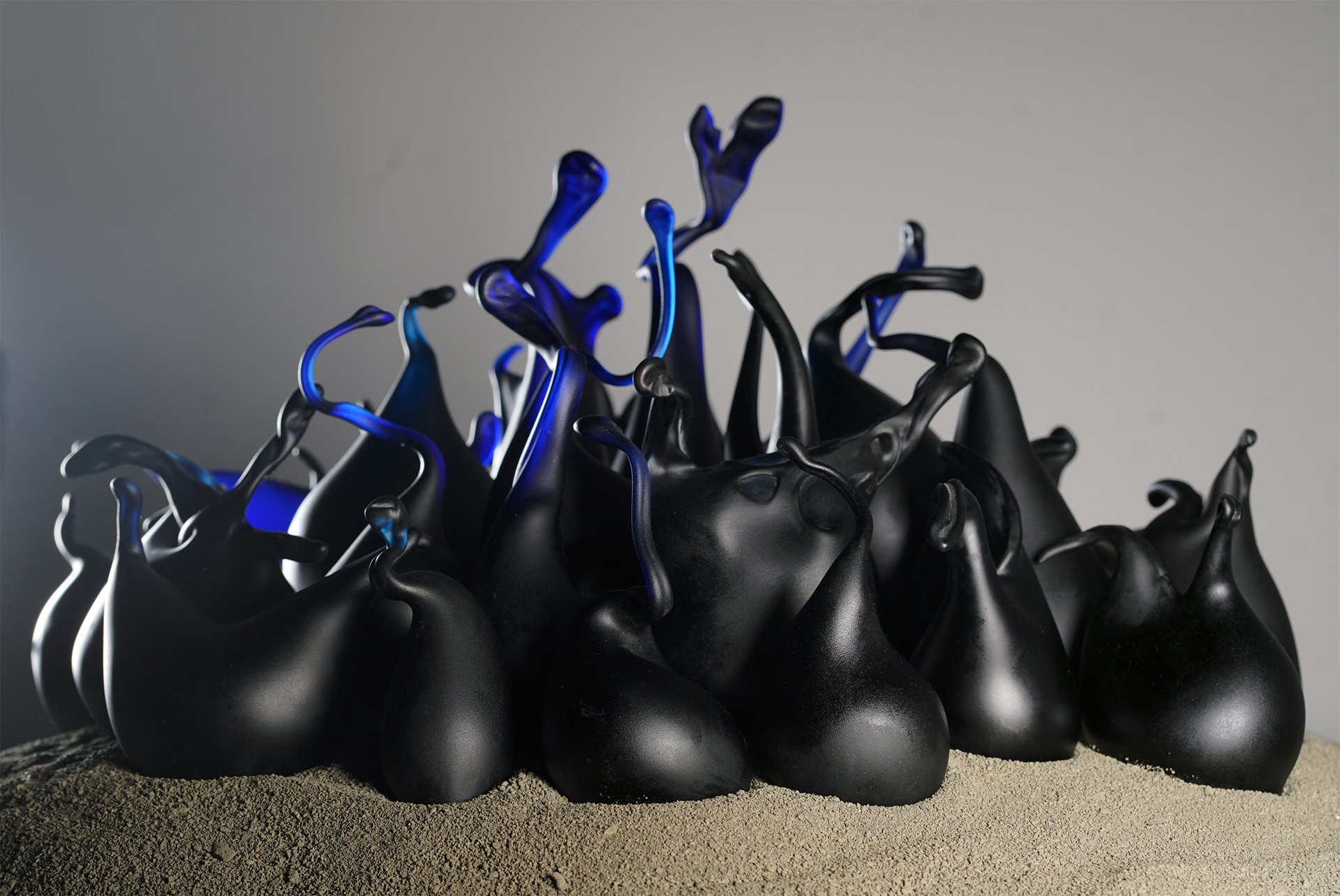   Nested Boutons,  hand blown black glass, 24 x 24 x 8 inches, 2024  