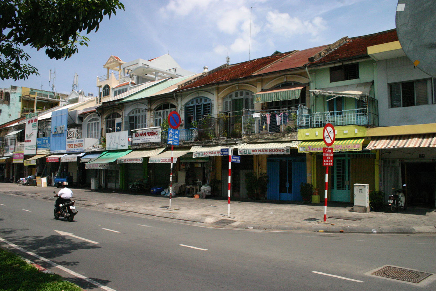 Two-storey colonial shophouses at 26-56 Võ Văn Kiệt, District 1.