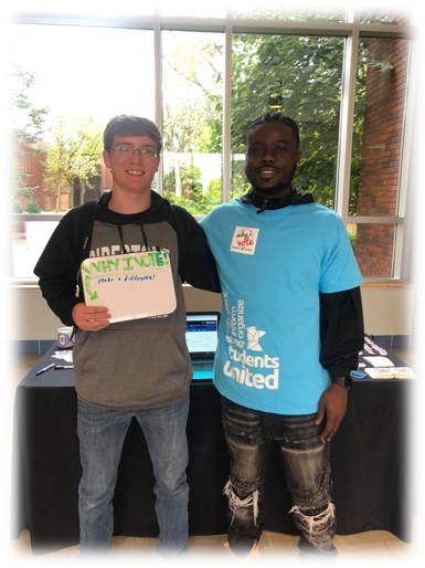Diversity Specialist, Samuel Wreh with a newly registered voter