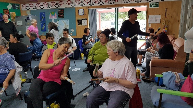 Waikawa Sit n' Be Fit participants enjoying 'Tītī tōrea' to music