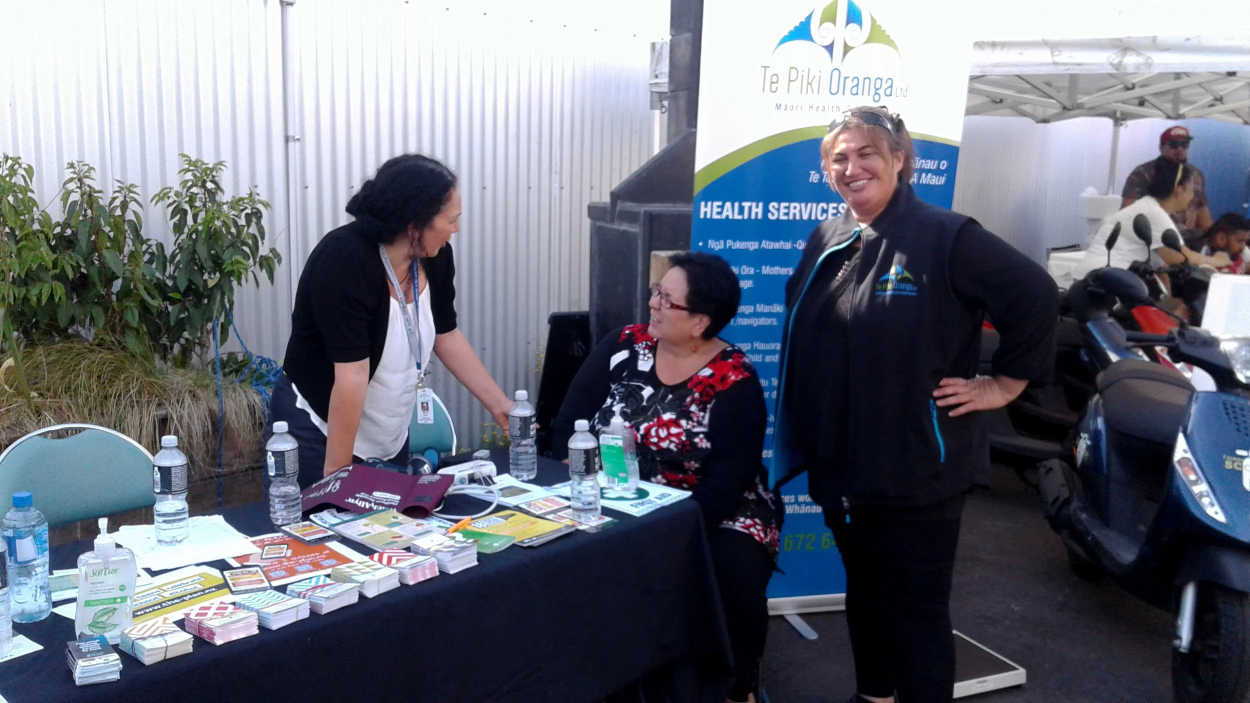 TPO nurse Marissa Scott talks with Rayma-Lee Kotu with AOD Clinician Debbie Tauwhare’s support