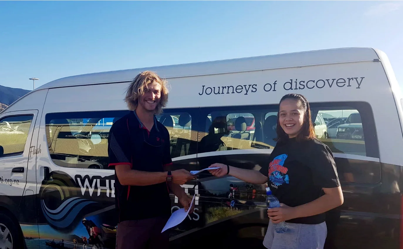 Waimaria donating the $150 car wash money she raised to Whenua-Iti