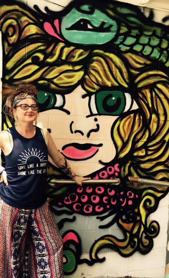 Kristal with her graffiti piece, "Pisces Gal"