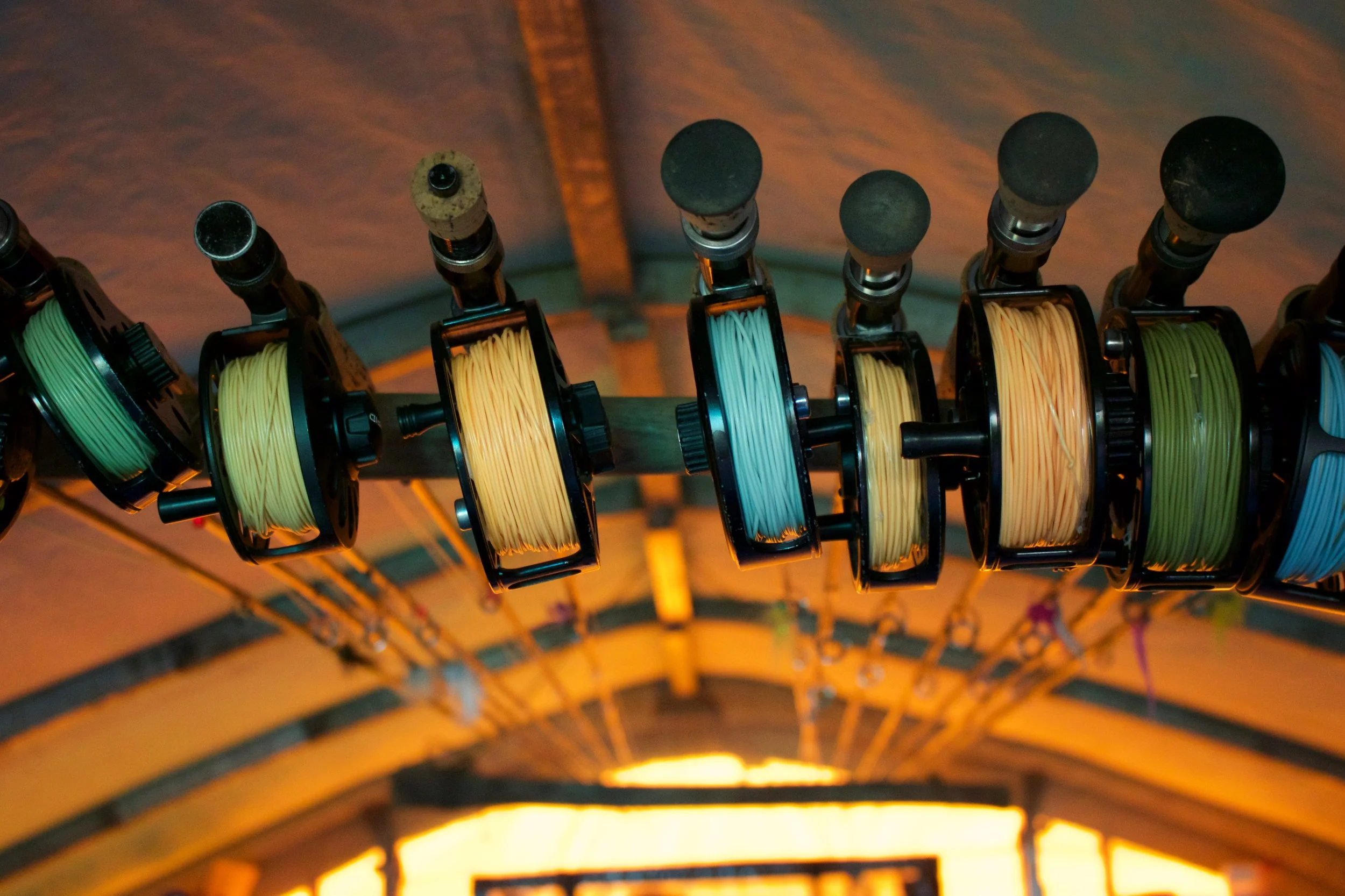 The rod rack adorns the ceiling of the Boars Nest. Official dirtbag guide tent. Locals only. 