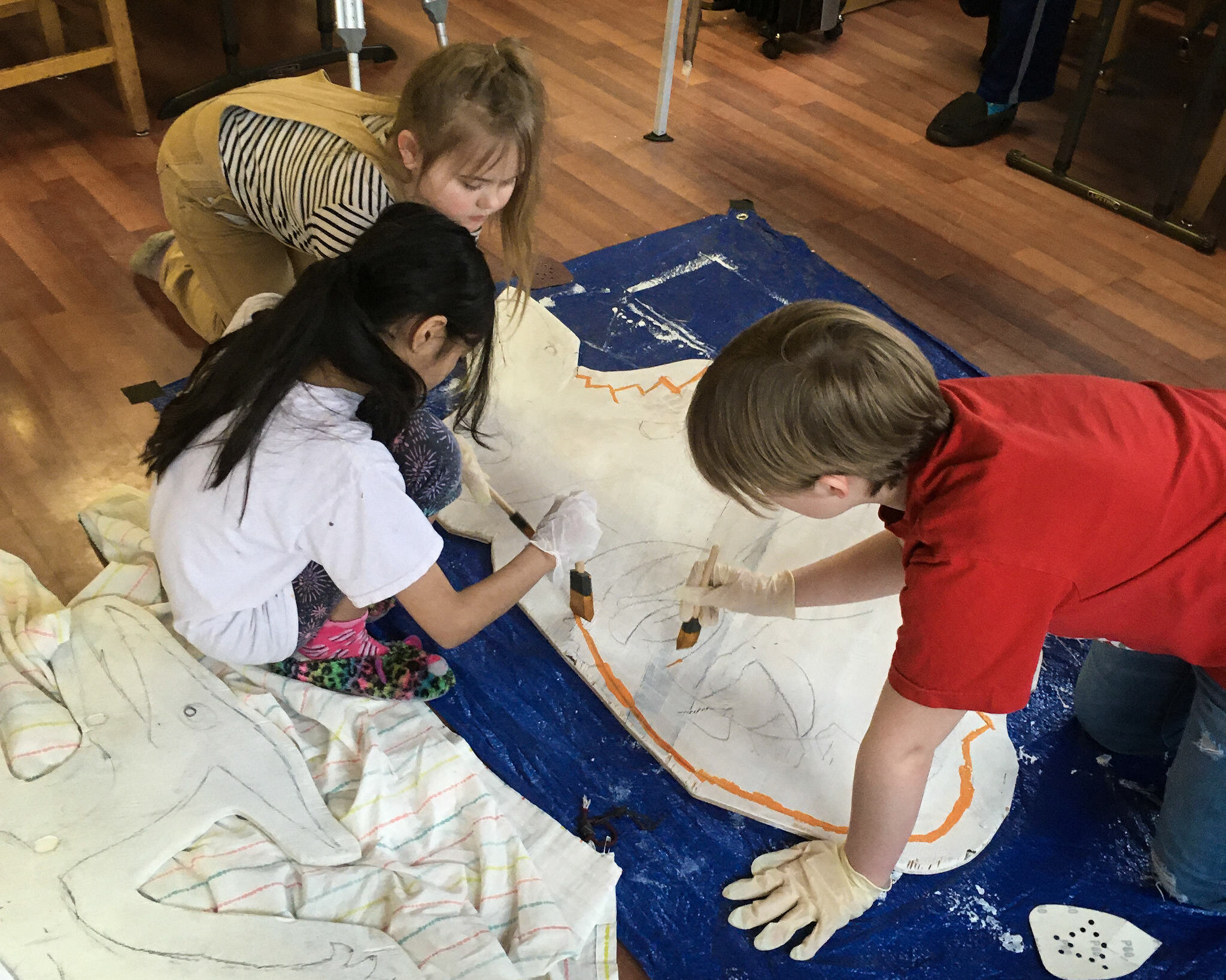 TDA kids painting dinosaur for Jurassic Playground.