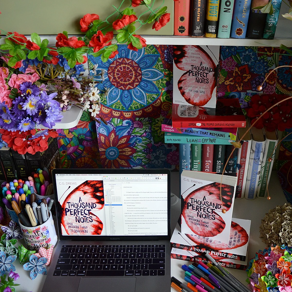 Author C. G. Drews writing desk