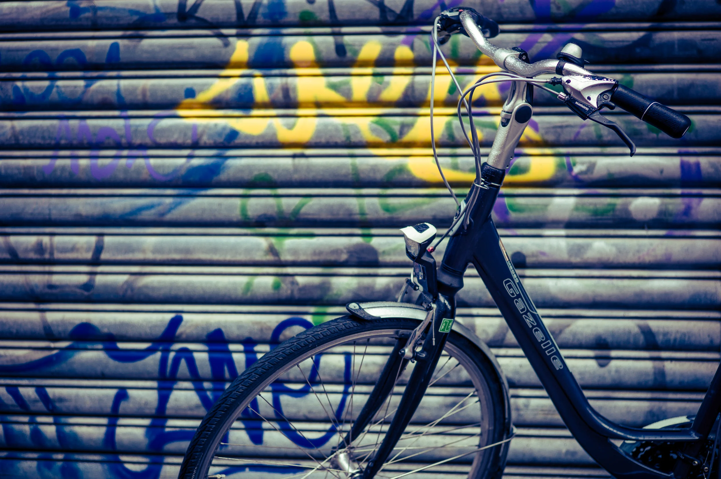 Bicycle in Front of Graffiti