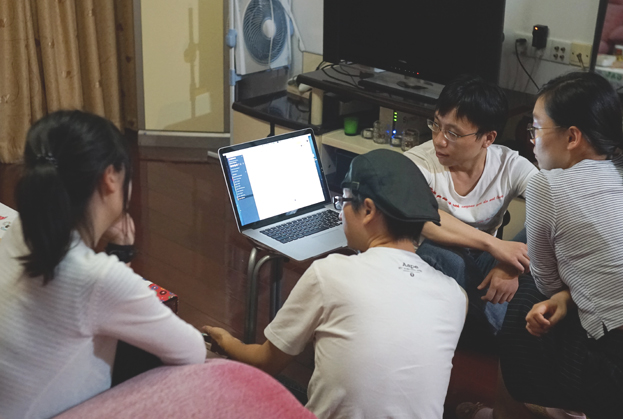 Thanks to our friend Fred, we finally had some co-working picture. From left to right: Betty(Artist), Fox(Manager), W.Guan(Programmer) and W.Qian(Musician)