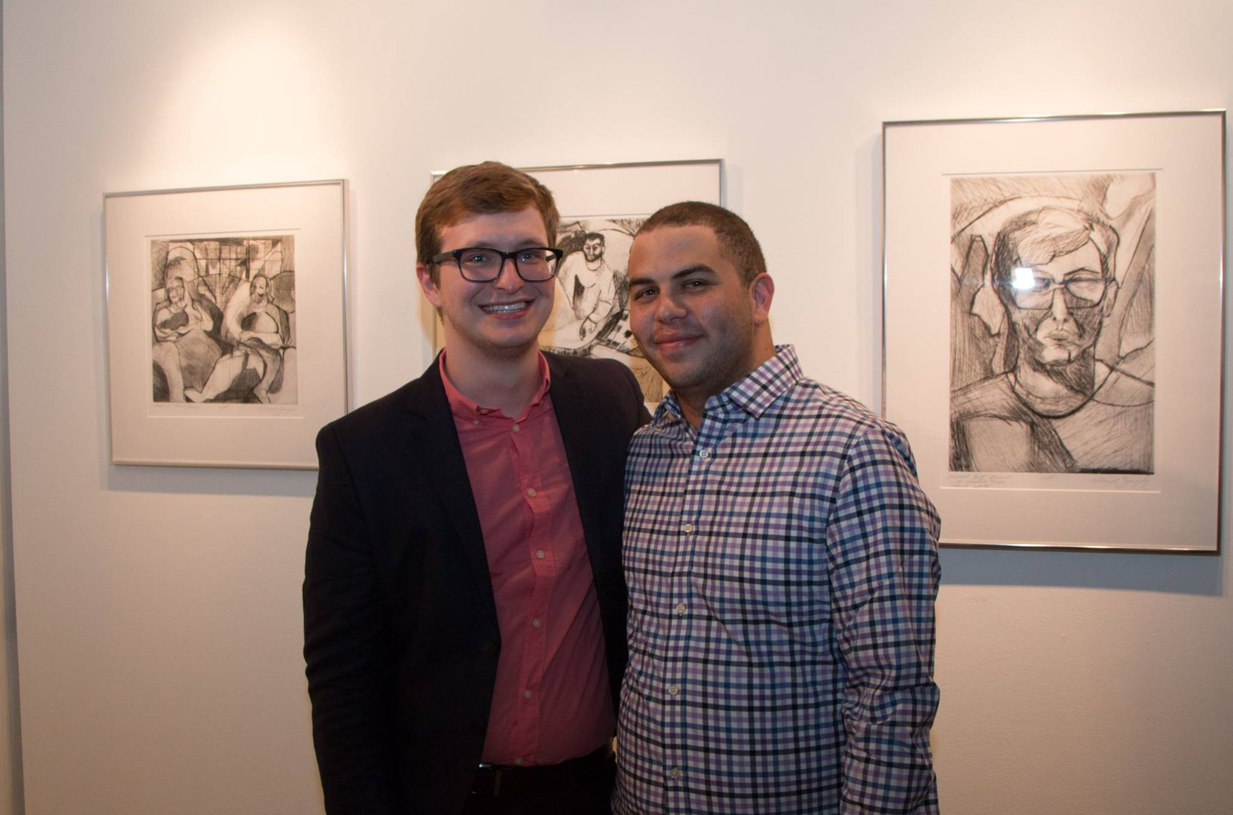  Two Ohioans, Micah Zavacky and his partner Anthony Birchfield in front of Micah's drypoints. Photo courtesy: Justine Kaszynski Photography.&nbsp; 