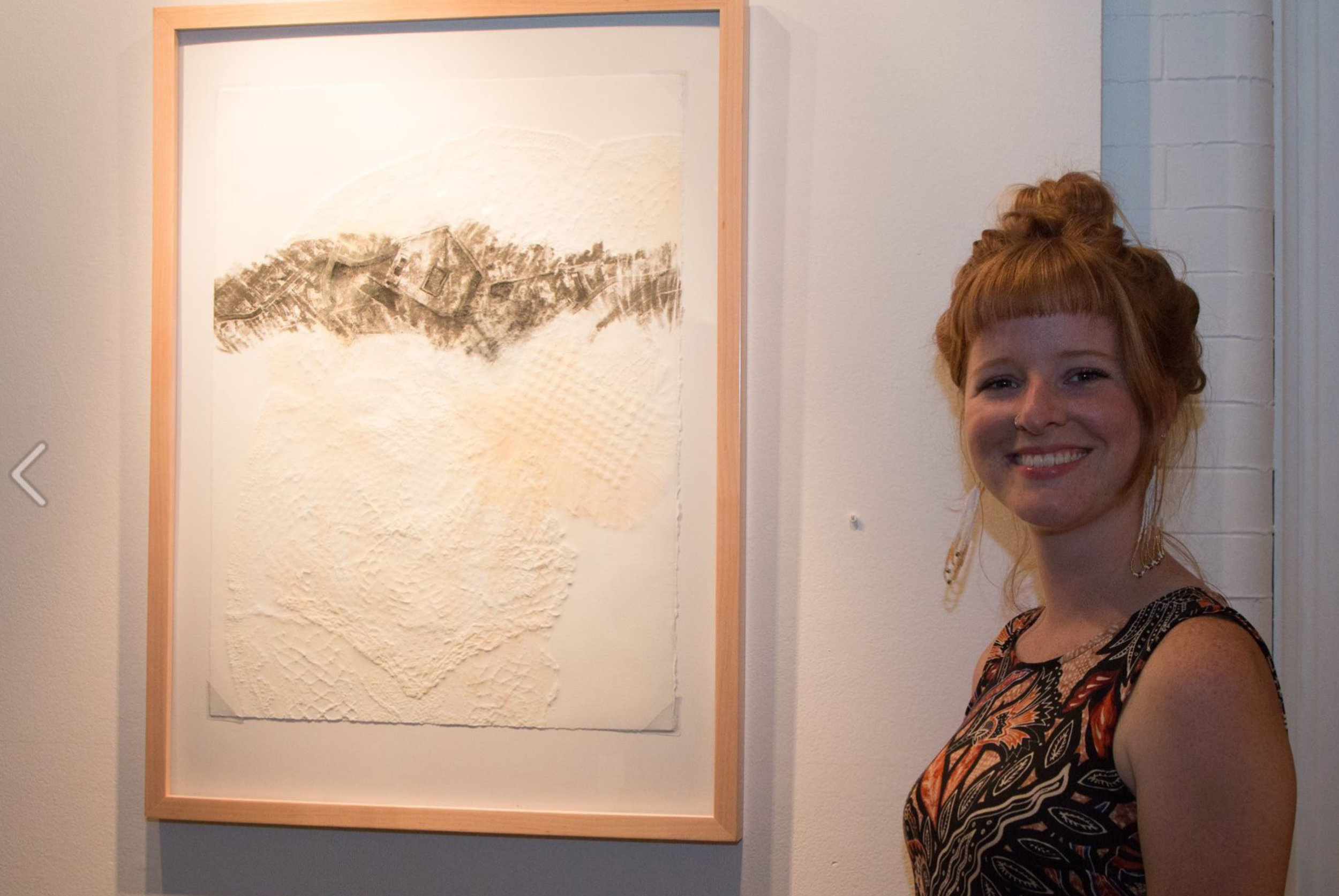  Graduate student Molly Markow poses alongside her work. Photo Courtesy: Justine Kaszynski Photography 