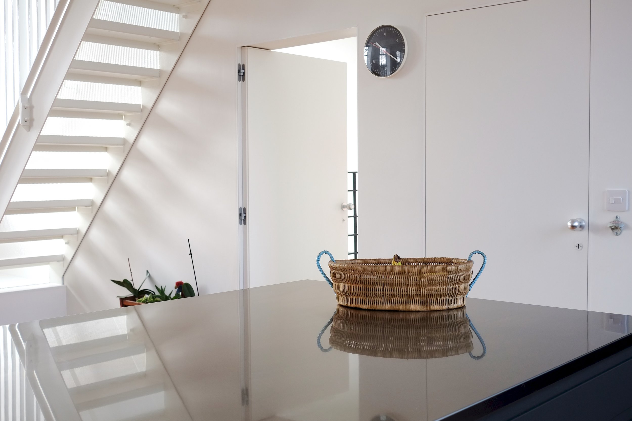 The bespoke steel stairs have a metal mesh in-between each step to let light through creating a wonderful shadowy pattern on the walls.