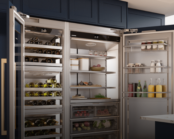 Open kitchen refrigerator with wine bottles, vegetables, condiments, and beverages inside.