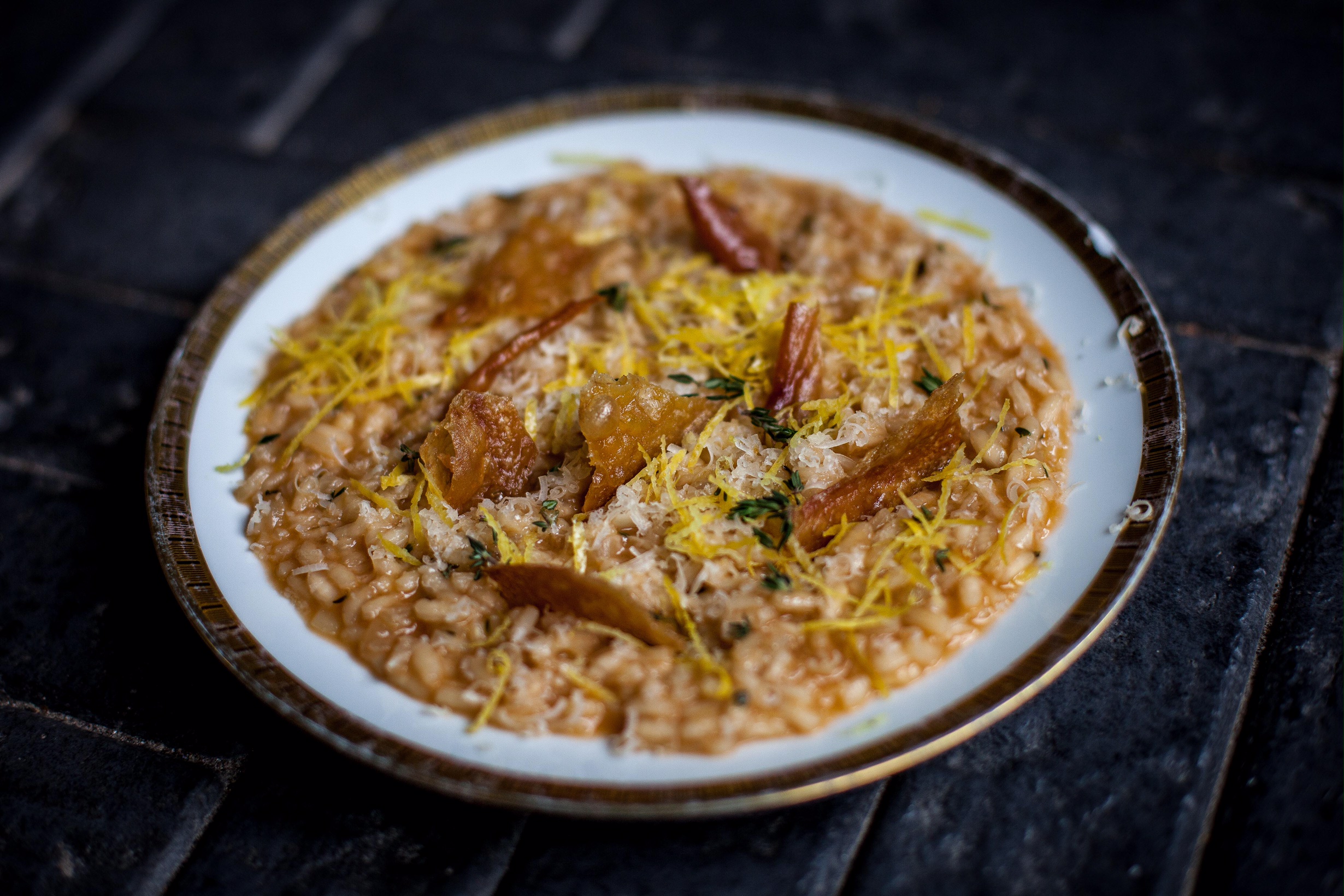 Risotto bianco with crispy chicken skin, thyme and lemon zest
