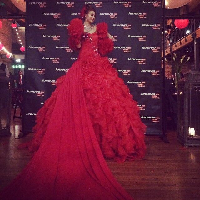 Red Carpet turns into a taller than average performer and her long red dress