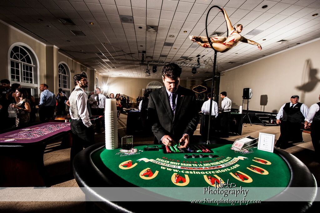 Aerialist performing on a Lollipop Lyra for a casino night themed event