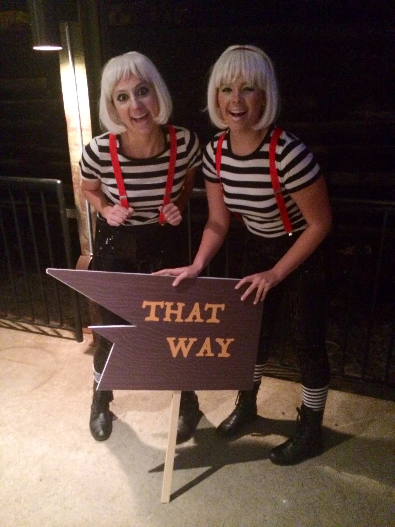 Two performers in Tweedle Dee inspired costumes for an Alice in Wonderland themed party