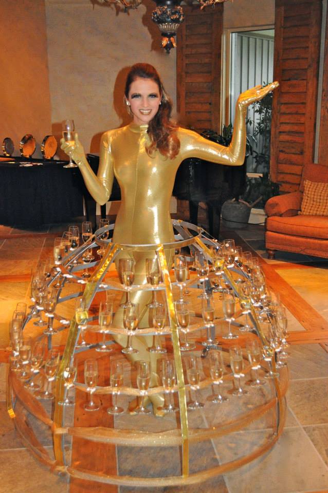 Goldfinger girl inspired performer inside a Champagne Dress handing out drinks during a James Bond themed event