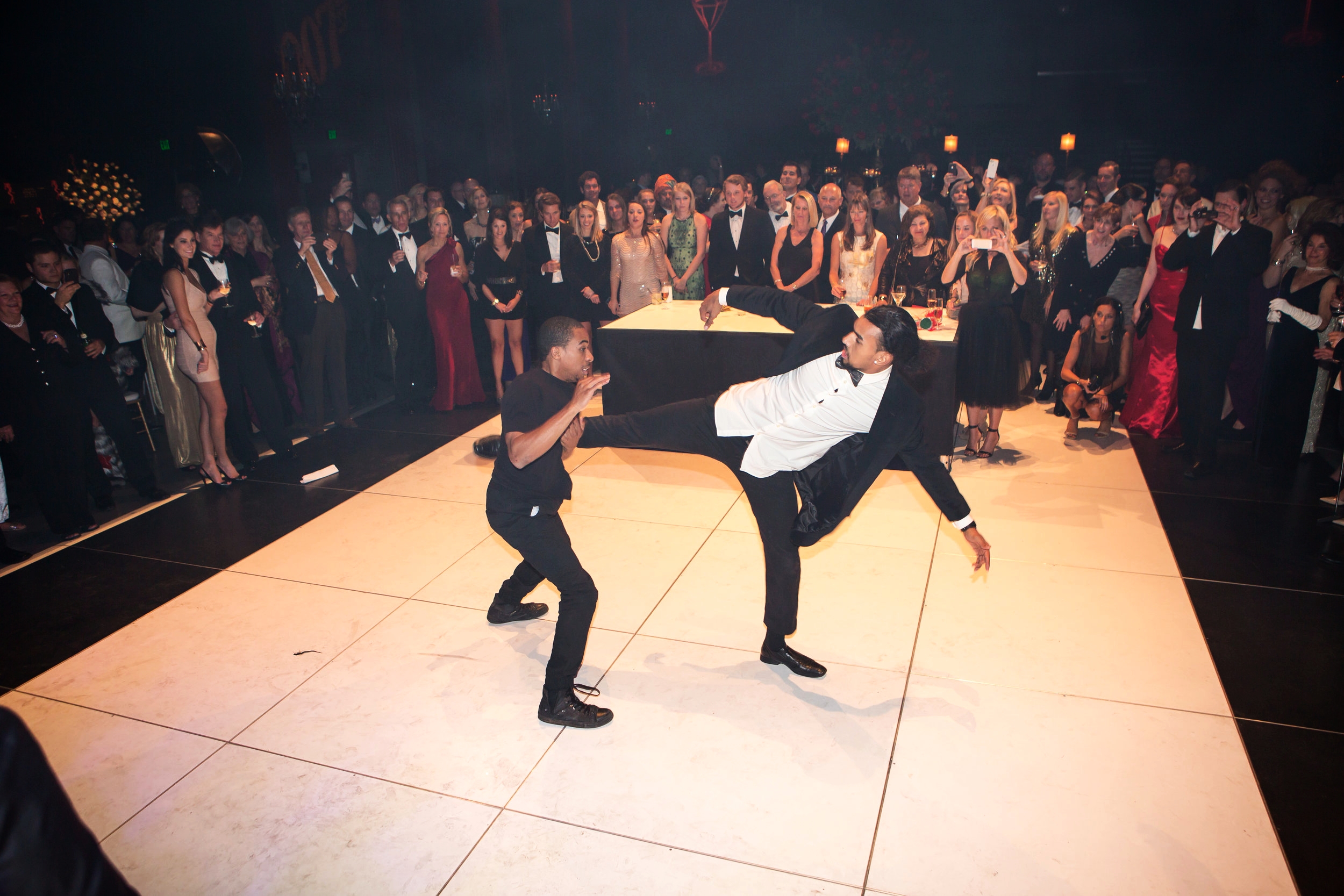 Dancers performing a James Bond inspired combat scene during an event