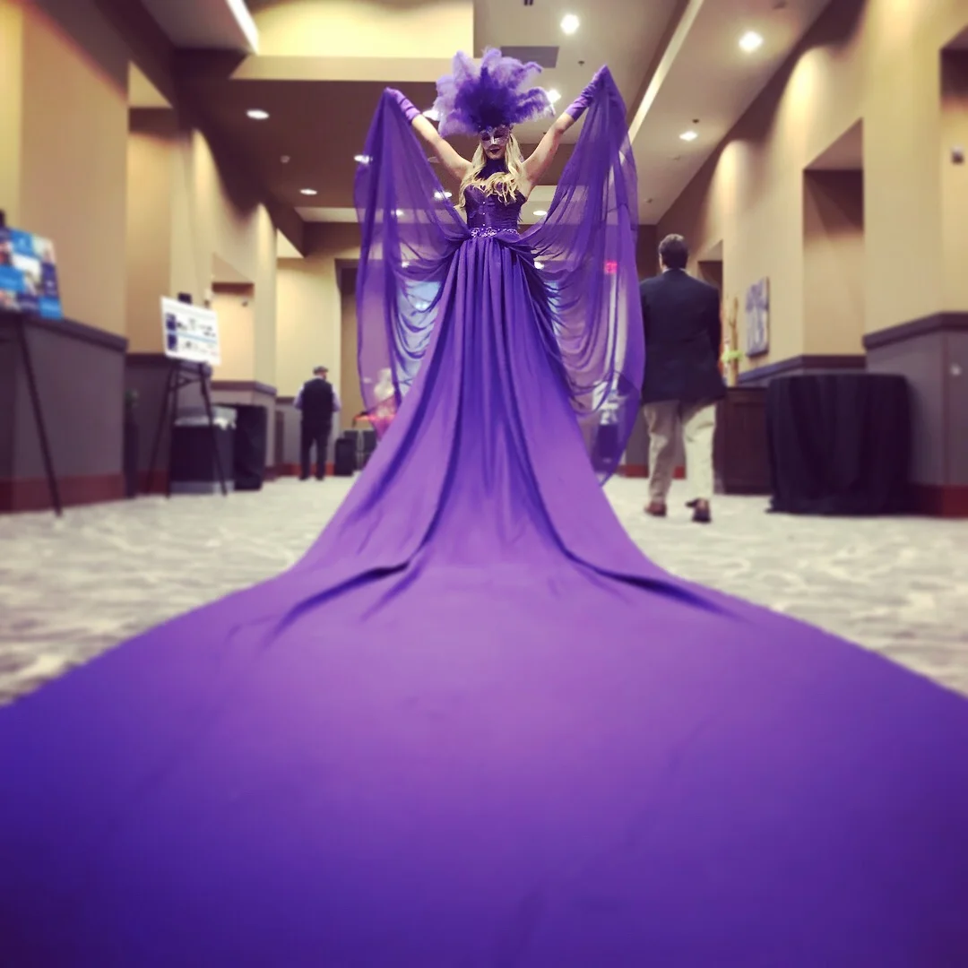 'Red Carpet' that is the color purple and turns into a taller than average performer and her long purple dress