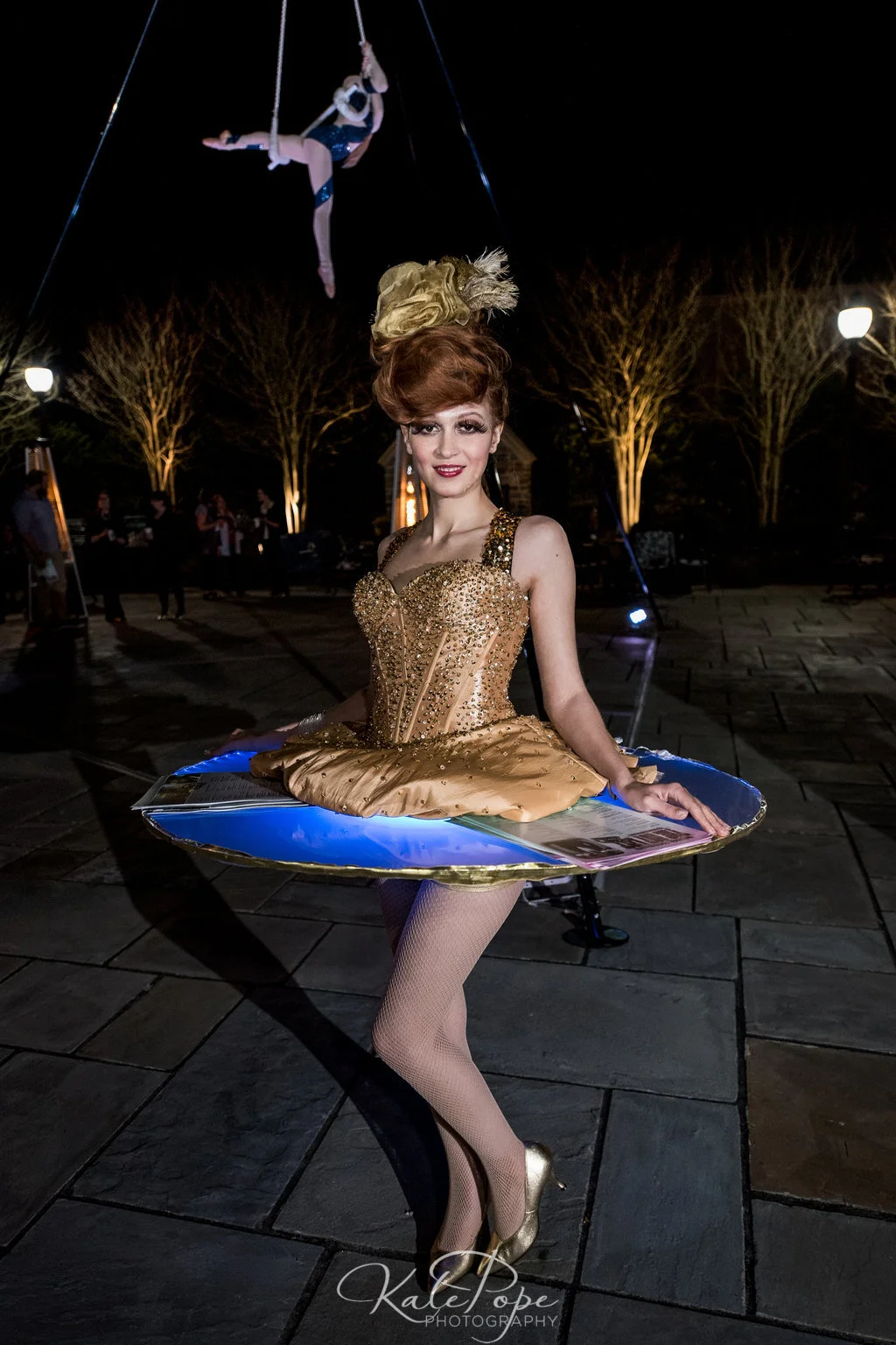 LED Table Performer Distributing Programs with Blue Accent Lighting