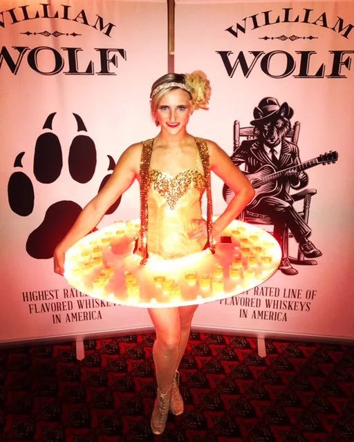 Gold LED Table Performer Offering Drinks at Luxury Event