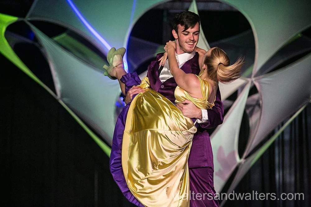 Male and Female Dancers Performing a Lift in a Swing Routine at 1950s Themed Event