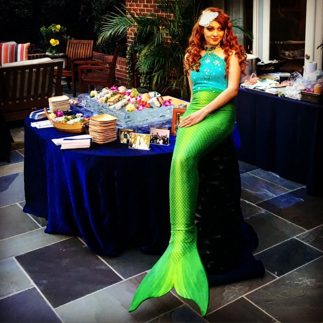 Mermaid on Food Table at Indoor Event