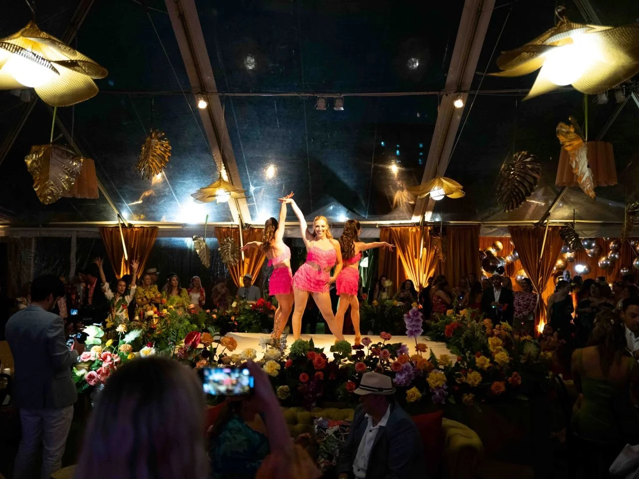 Trio of Dancers in Pink Fringe Performing a Latin-Inspired Routine in Raleigh, NC