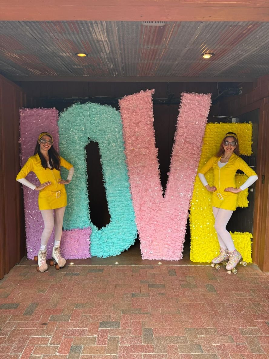 1960s LOVE-Themed Roller Skater Duo in Yellow