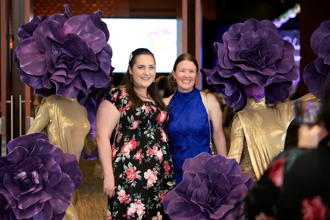 Two Gold and Purple Living Centerpieces with Guests in Raleigh