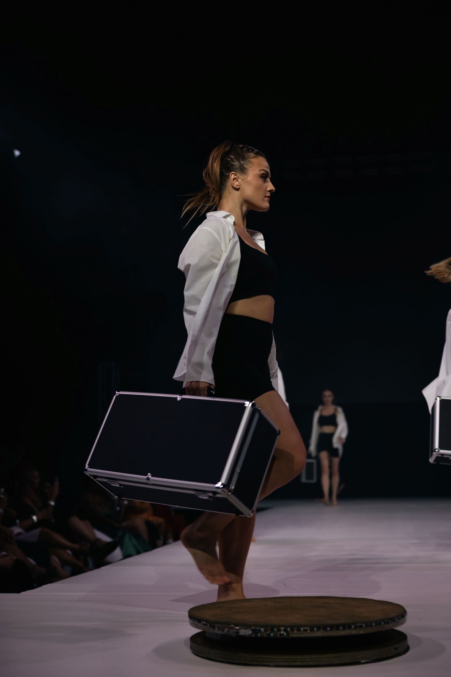 Dancer with Suitcase in Theatrical Fashion Show